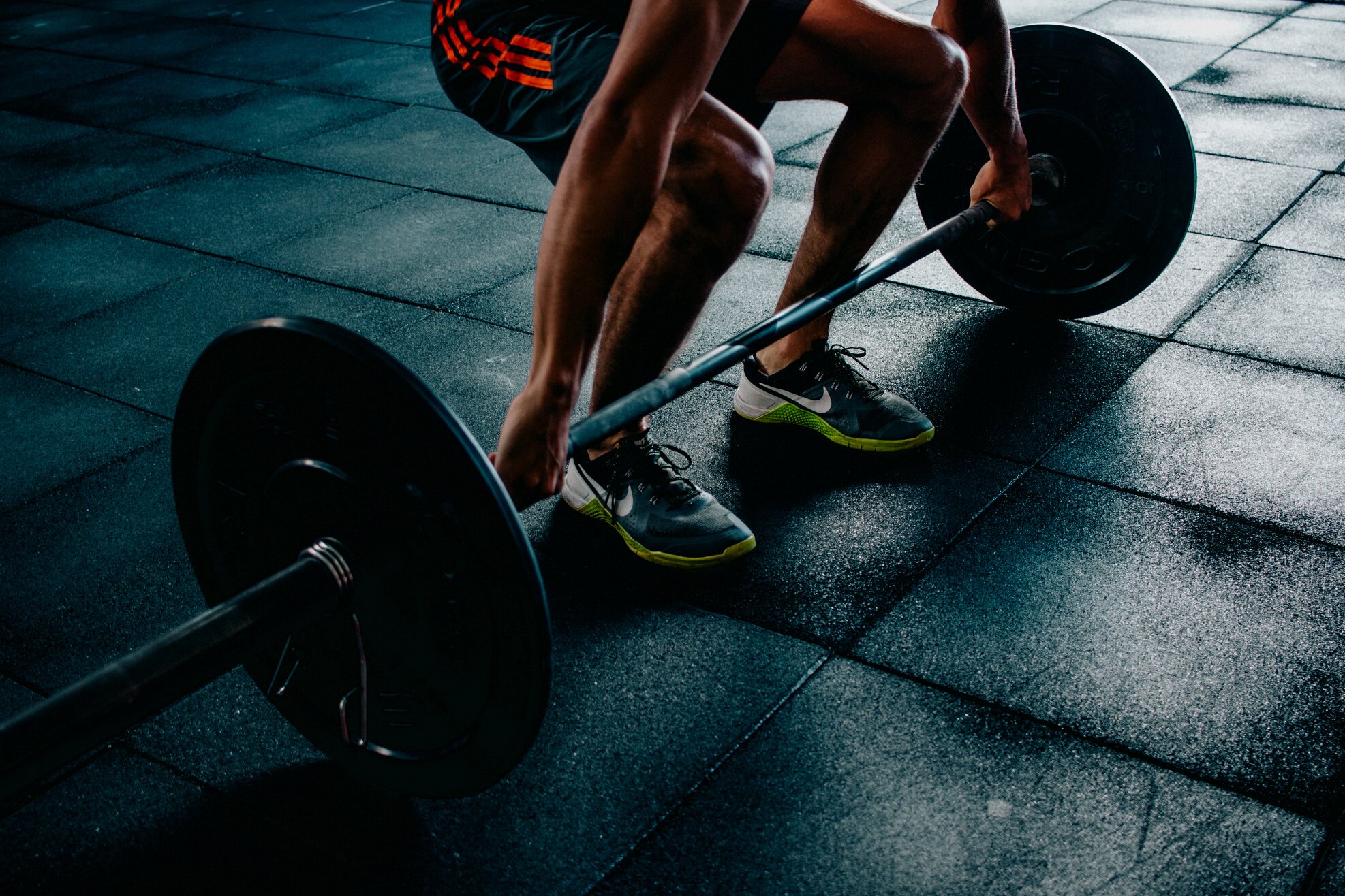 Person Holding Barbell